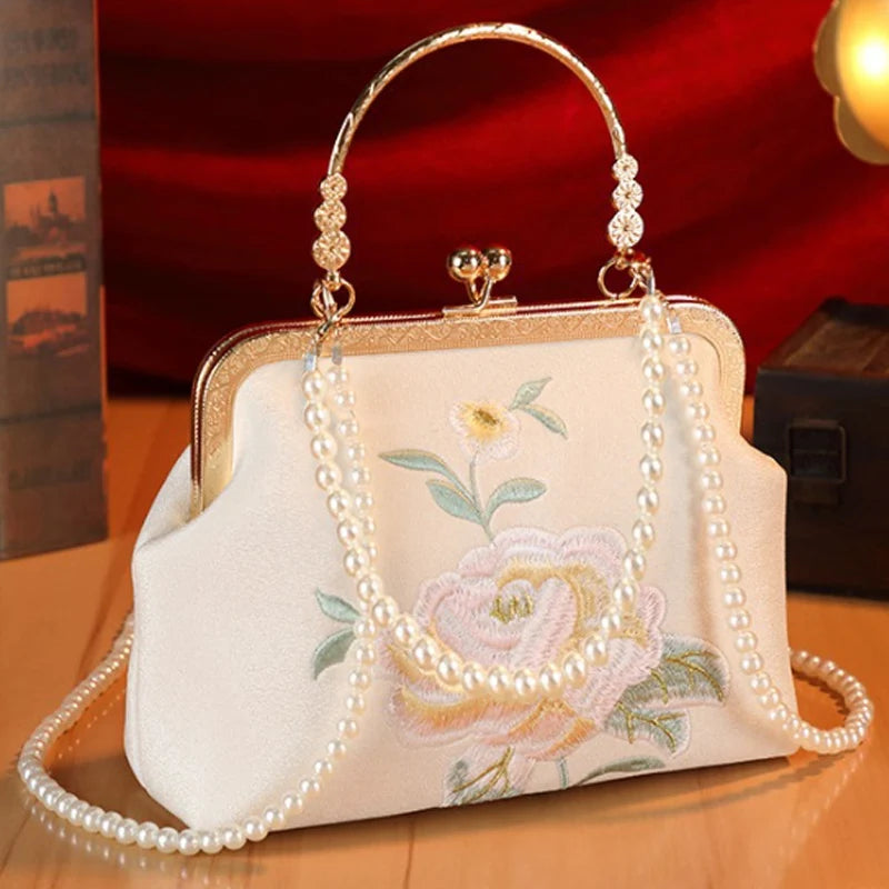 Elegant cream handbag with floral embroidery